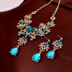 French palace style jewelry set with blue crystals and gold flower necklace earrings