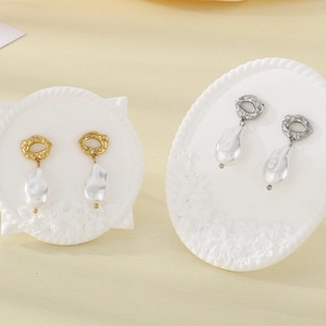 French style baroque pearl drop earrings in gold and silver plating on art stands