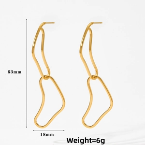Detail of gold geometric wave drop earrings with 63mm length and minimalist design