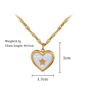 Detailed view of heart necklace size 1.7x2cm and weight 8.2g with gold star shell inlay