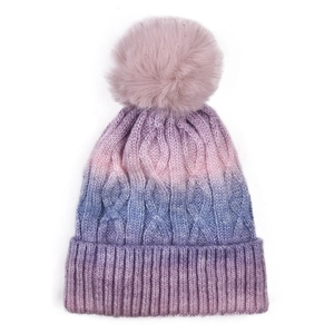 Close-up of winter knit beanie with thick cable patterns and gradient pink blue purple hues