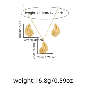 Detail view of gold leaf necklace and earrings set with exact dimensions and weight specs