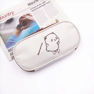 Detailed close-up of the skateboard bear pencil case with zipper and brown trim details