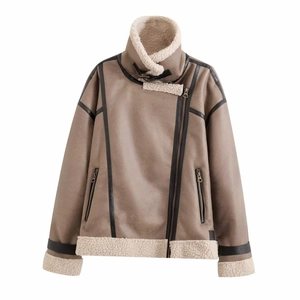 Detail of taupe faux suede jacket with white shearling lining and black faux leather trims