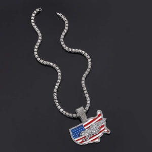 Macro detail of iced-out tennis chain with US flag map and eagle hip hop pendant