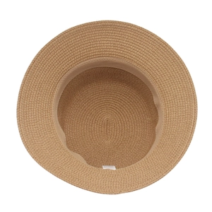 Top down view of woven straw bucket hat showing interior lining and texture