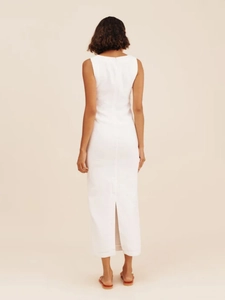 Detail of the back slit design on a minimalist white square neck sleeveless maxi dress