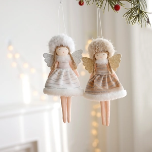 Plush Christmas angel pendants with shimmering wings on a festive pine branch