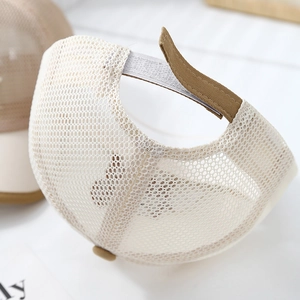 Detail of breathable mesh fabric and adjustable velcro strap on summer baseball cap