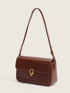 Classic dark brown leather shoulder bag with gold dual-ring buckle in a side profile view