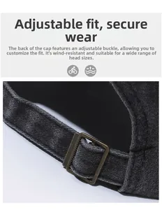 Macro shot of dark grey baseball cap with adjustable bronze metal buckle back closure