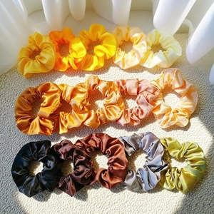 Set of 15 premium satin silk scrunchies in assorted yellow, orange and earth tones