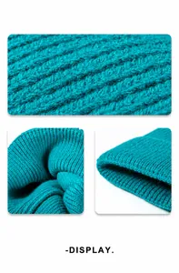 Macro detail of the vertical ribbed knit pattern on a cyan knitted beanie hat