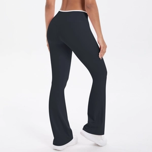 Close-up back view of high-waisted flared yoga pants with white contrast waist detail