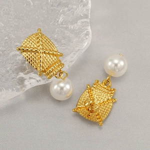 Golden woven square titanium steel earrings with white pearl pendants in minimalist style