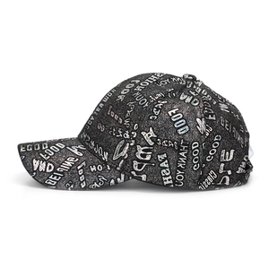 Detail of black baseball cap with metallic silver letters and sparkling fabric texture