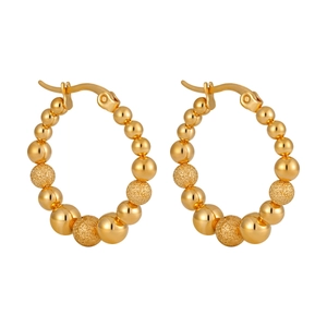 Minimalist gold hoop earrings featuring alternating polished and frosted bead textures