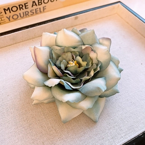 Elegant teal gradient fabric orchid hair clip with yellow pistils and soft blue petals