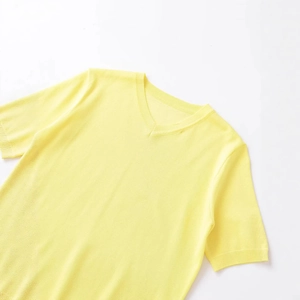 Bright yellow short sleeve knit sweater featuring a classic V-neck and ribbed cuffs