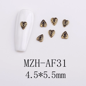 Macro detail of MZH-AF31 retro gold heart nail art charms measuring 4.5 by 5.5 mm