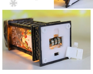 Detail view of vintage Christmas lantern base with button cell battery compartment and switch