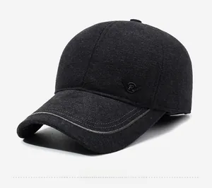 Detail of winter baseball cap showing wool fabric texture and metal wing R-logo emblem