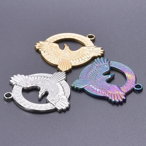 Detailed view of eagle pendants in gold, silver and rainbow finishes with Celtic patterns