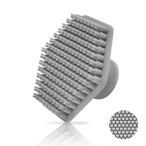 Grey silicone facial brush detail showing soft bristles and hexagonal non-slip grip base