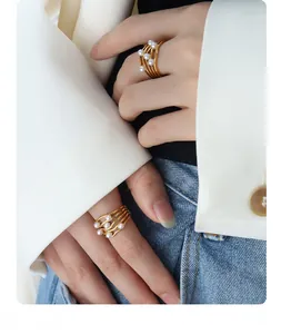 Detail of vintage French wave ring with multi-layer gold plating and white pearls