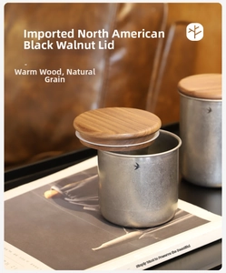 Macro detail of black walnut wood lid and silicone seal on stainless steel canister