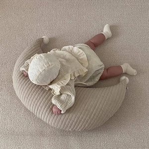 Newborn crescent moon nursing pillow with striped cotton texture and lace embroidery