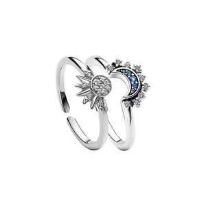 Adjustable sun and moon couple rings set with sparkling blue and white zirconia
