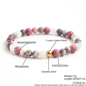 Natural Rhodochrosite beaded bracelet with gold stainless steel bead on white background