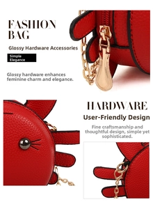 Detail view of red crab purse showing lychee leather texture and gold metal hardware