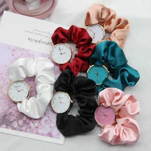 Elegant ribbon strap watches for women in six colors with gold cases on floral background