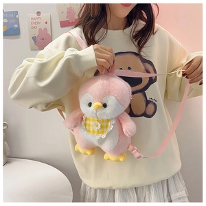 Detail of cute pink plush penguin crossbody bag with adjustable strap and daisy embroidery