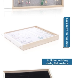 Detail view of solid wood jewelry tray featuring velvet ring slots and dustproof cover