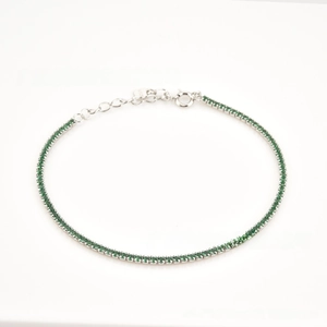 Detailed macro view of S925 sterling silver tennis bracelet with green zircon stones