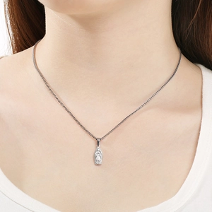 Detailed relief of religious Virgin Mary pendant on silver box chain necklace