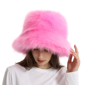 Detail of bright pink faux fur bucket hat showing the fluffy plush texture and wide brim