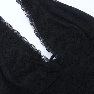 Detailed close-up of intricate black lace floral patterns and delicate edge embroidery