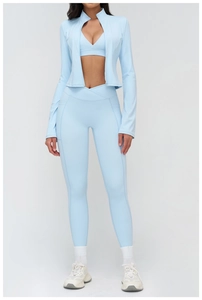 Detailed view of light blue yoga jacket with stand collar and zipper closure