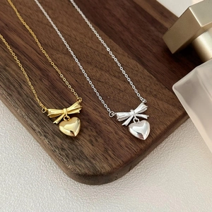 Elegant 925 sterling silver bow and heart pendant necklace in gold and silver finish