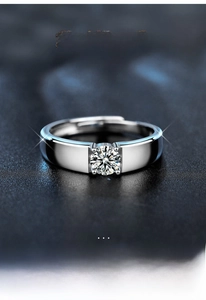 Macro shot of 925 sterling silver ring featuring a sparkling moissanite diamond in a four-prong setting