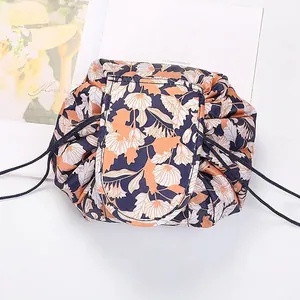 Macro detail of floral drawstring makeup bag with secure top flap and rope closure