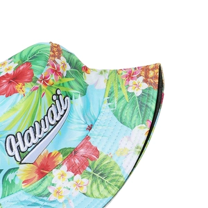 Close-up of tropical floral pattern and 3D Hawaii embroidery on a canvas bucket hat