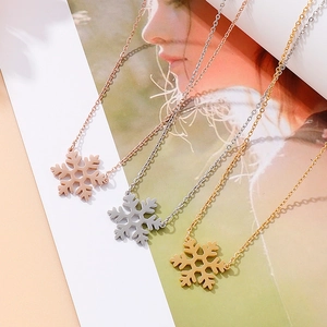 Snowflake pendant necklaces in rose gold, silver, and gold finishes for Christmas gifts