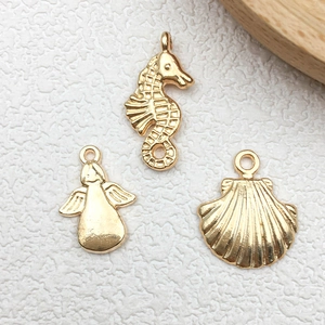 Golden seahorse, angel, and shell metal charms for DIY jewelry making accessories