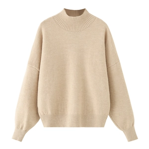 Detailed knit texture of oatmeal mock neck sweater with ribbed cuffs and soft fabric