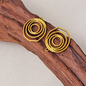 Golden 304 stainless steel irregular concentric circle pendant on textured wood surface